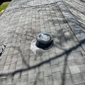 exterior view of tubular skylight on roof